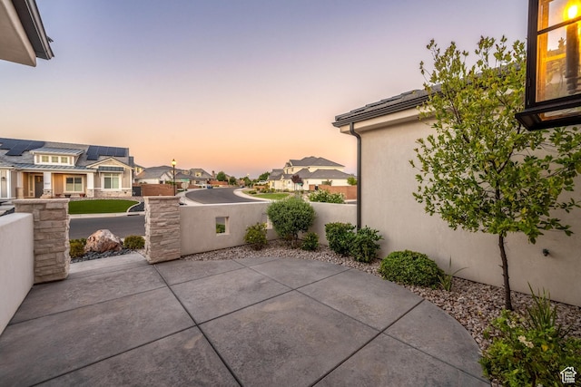 2530 S Monterosa Ln, St George, UT 84790 - patio terrace at dusk with a residential view and a patio