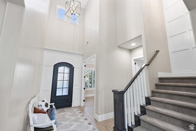 2530 S Monterosa Ln, St George, UT 84790 - entryway with a towering ceiling, light wood-style flooring, stairway, and a chandelier