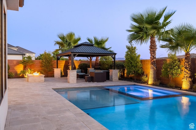 2530 S Monterosa Ln, St George, UT 84790 - view of swimming pool with a fire pit, a patio, a pool with connected hot tub, and a fenced backyard