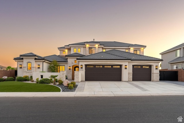 2530 S Monterosa Ln, St George, UT 84790 - prairie-style home with a garage, stone siding, driveway, and stucco siding