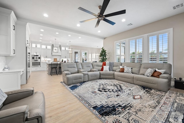 2530 S Monterosa Ln, St George, UT 84790 - living area with light wood-type flooring, ceiling fan, and recessed lighting