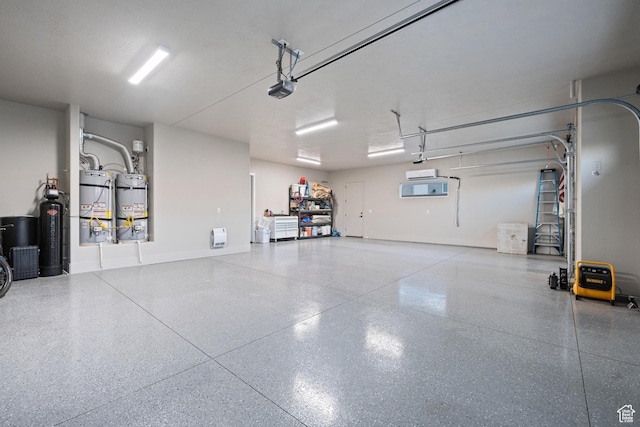 2530 S Monterosa Ln, St George, UT 84790 - garage featuring secured water heater and a garage door opener
