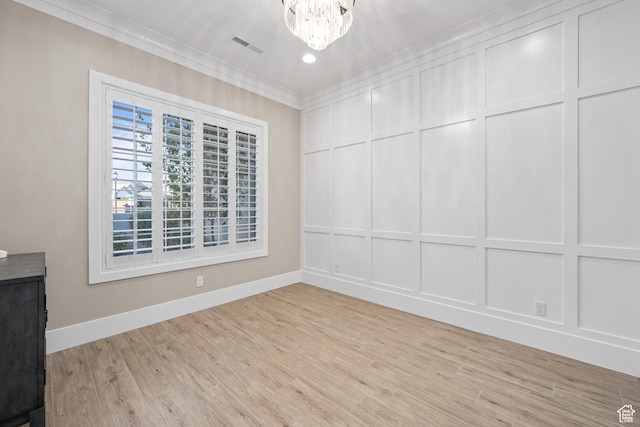 2530 S Monterosa Ln, St George, UT 84790 - spare room with a decorative wall, crown molding, a chandelier, light wood finished floors, and recessed lighting