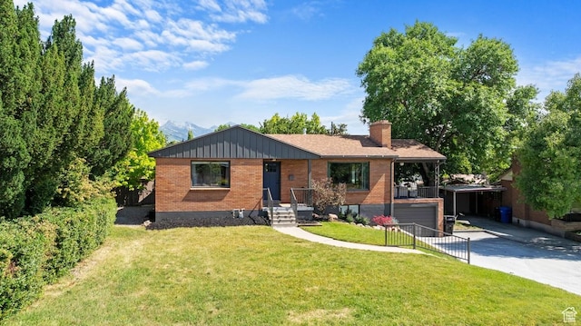 1876 E Northwoodside Dr S, Holladay, UT 84124 - view of front of home featuring driveway, brick siding, a chimney, a front lawn, and a garage