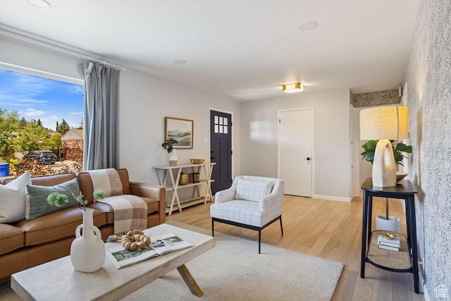 1876 E Northwoodside Dr S, Holladay, UT 84124 - living area featuring light wood-style flooring and baseboards