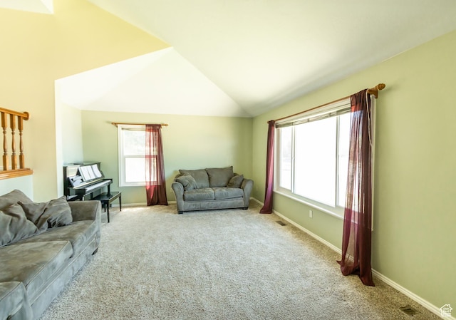 2908 N Cherry Dr E, North Ogden, UT 84414 - living area with carpet floors and vaulted ceiling