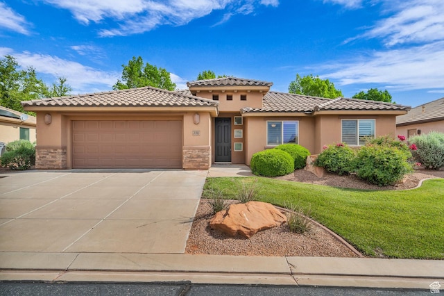 336 W 270 S, Ivins, UT 84738 - view of front of home featuring stucco siding, a tiled roof, stone siding, an attached garage, and driveway