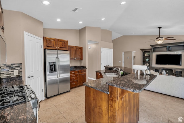 336 W 270 S, Ivins, UT 84738 - kitchen with appliances with stainless steel finishes, vaulted ceiling, a ceiling fan, brown cabinets, and light tile patterned flooring