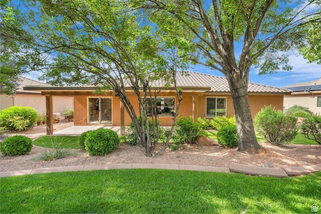 336 W 270 S, Ivins, UT 84738 - rear view of property with stucco siding, a tile roof, a lawn, and a patio area