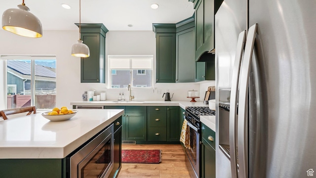 312 N 240 E, Vineyard, UT 84059 - kitchen featuring green cabinetry, stainless steel appliances, light wood-style flooring, light countertops, and recessed lighting