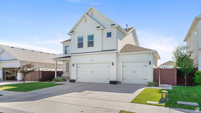 312 N 240 E, Vineyard, UT 84059 - view of front of house with concrete driveway, roof with shingles, and a garage