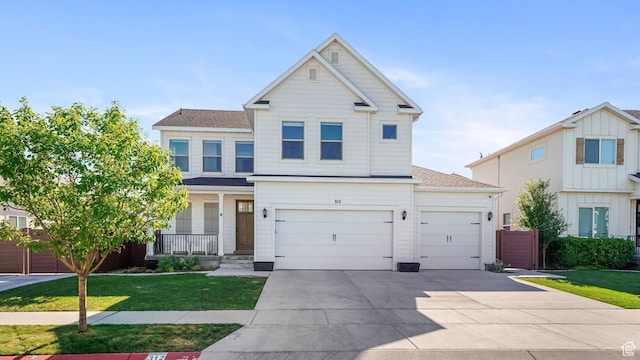 312 N 240 E, Vineyard, UT 84059 - view of front facade featuring concrete driveway, a front lawn, a shingled roof, a garage, and an attached garage