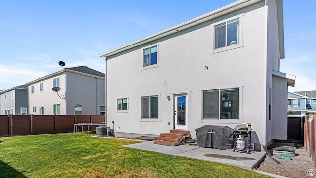 312 N 240 E, Vineyard, UT 84059 - back of house with entry steps, a fenced backyard, a patio area, and stucco siding