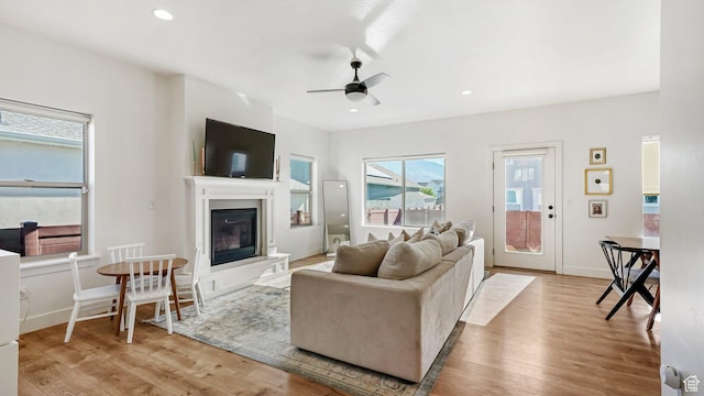 312 N 240 E, Vineyard, UT 84059 - living room featuring a ceiling fan, wood finished floors, a glass covered fireplace, and recessed lighting
