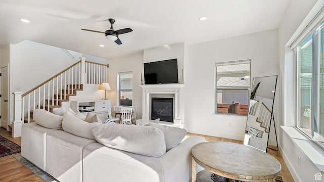312 N 240 E, Vineyard, UT 84059 - living area featuring stairs, a glass covered fireplace, light wood-style floors, and recessed lighting