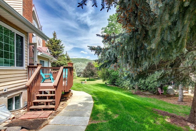 2953 W Wildflower Ct Unit 35, Park City, UT 84098 - view of green lawn with a deck with mountain view