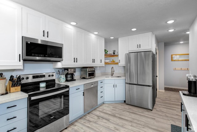 2953 W Wildflower Ct Unit 35, Park City, UT 84098 - kitchen with stainless steel appliances, open shelves, white cabinets, light countertops, and recessed lighting