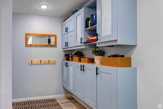 2953 W Wildflower Ct Unit 35, Park City, UT 84098 - kitchen with open shelves, light wood-type flooring, and light countertops