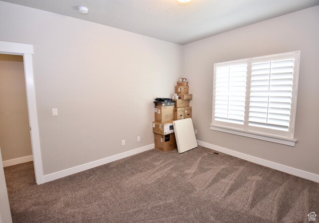 397 S Trejo Ridge Rd E, Grantsville, UT 84029 - unfurnished bedroom featuring carpet flooring and baseboards
