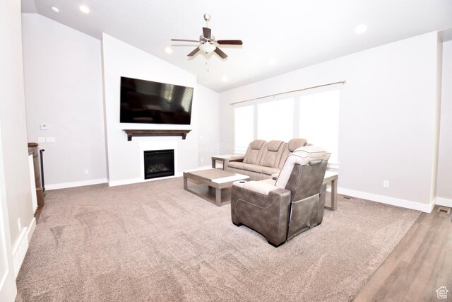 397 S Trejo Ridge Rd E, Grantsville, UT 84029 - living room featuring vaulted ceiling, a ceiling fan, a fireplace, recessed lighting, and wood finished floors