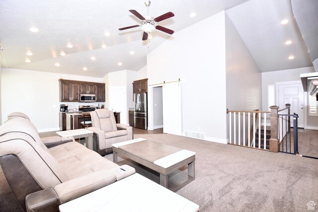 397 S Trejo Ridge Rd E, Grantsville, UT 84029 - living room with a ceiling fan, recessed lighting, high vaulted ceiling, light carpet, and a barn door