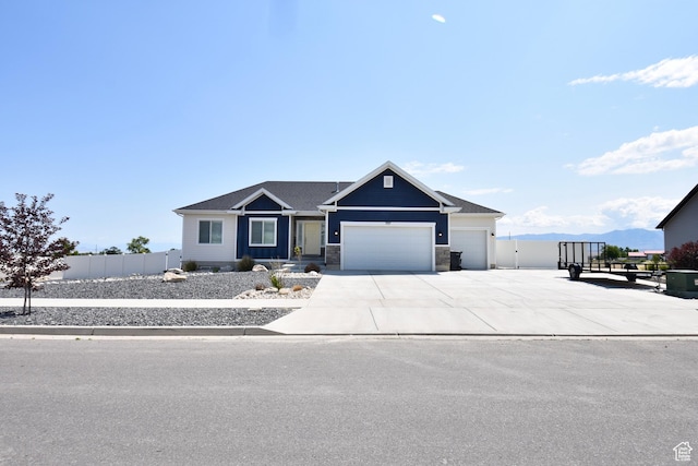 397 S Trejo Ridge Rd E, Grantsville, UT 84029 - view of front of property featuring an attached garage, driveway, and stone siding