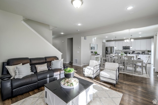 6459 N Star Discovery Way W, Stansbury Park, UT 84074 - living room with recessed lighting, dark wood-style flooring, a chandelier, and stairs