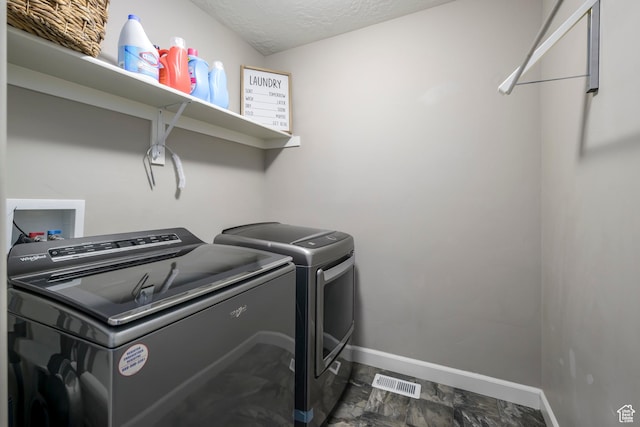 6459 N Star Discovery Way W, Stansbury Park, UT 84074 - washroom with washer and clothes dryer and a textured ceiling