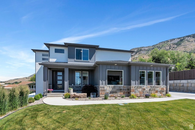 113 N 1400 E, Pleasant Grove, UT 84062 - view of front of house with a mountain view, board and batten siding, covered porch, and stone siding