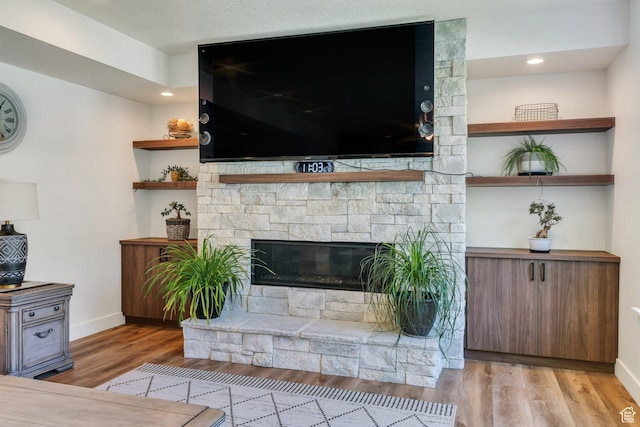 113 N 1400 E, Pleasant Grove, UT 84062 - unfurnished living room with wood finished floors and a stone fireplace