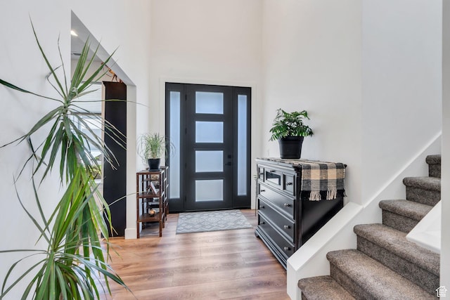 113 N 1400 E, Pleasant Grove, UT 84062 - foyer with stairs, light wood-style flooring, and a high ceiling