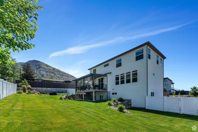 113 N 1400 E, Pleasant Grove, UT 84062 - back of house featuring a fenced backyard, a gate, stucco siding, and a deck with mountain view