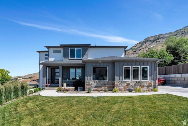 113 N 1400 E, Pleasant Grove, UT 84062 - view of front facade with board and batten siding, a mountain view, and stone siding