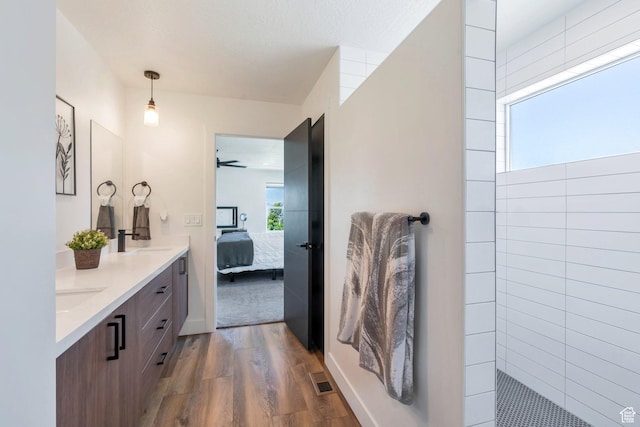 113 N 1400 E, Pleasant Grove, UT 84062 - bathroom featuring wood finished floors, double vanity, ensuite bathroom, walk in shower, and a ceiling fan