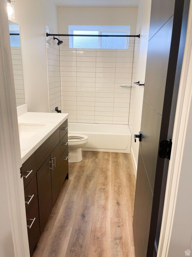 113 N 1400 E, Pleasant Grove, UT 84062 - bathroom featuring vanity, wood finished floors, and bathing tub / shower combination