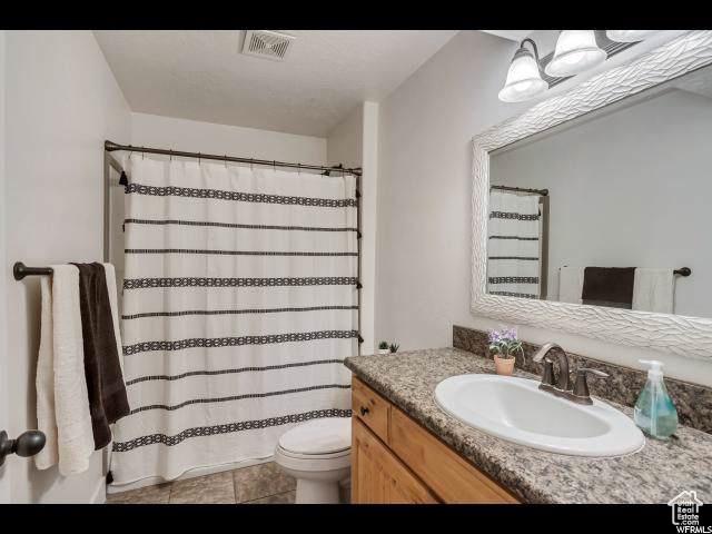 1045 S 1700 W Unit 320, Payson, UT 84651 - full bathroom with vanity, tile patterned floors, and a shower with shower curtain