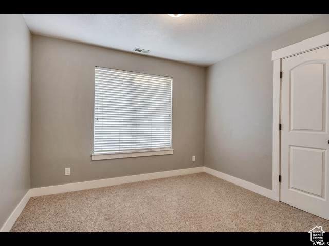 1045 S 1700 W Unit 320, Payson, UT 84651 - empty room featuring carpet flooring and baseboards