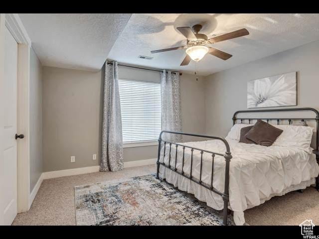 1045 S 1700 W Unit 320, Payson, UT 84651 - bedroom with carpet floors, a ceiling fan, and a textured ceiling