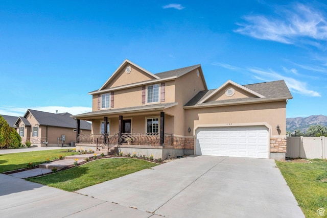 1198 N Reese Dr, Provo, UT 84601 - view of front of home featuring covered porch, stone siding, stucco siding, and concrete driveway