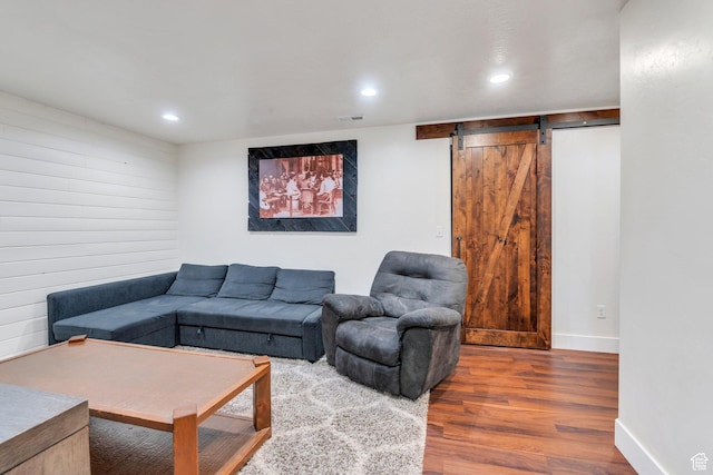 1198 N Reese Dr, Provo, UT 84601 - living area with wood finished floors, a barn door, and recessed lighting