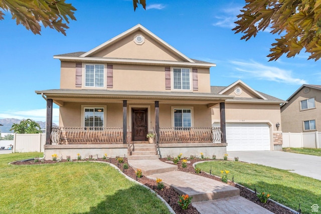 1198 N Reese Dr, Provo, UT 84601 - view of front of property featuring stucco siding, covered porch, a garage, and concrete driveway