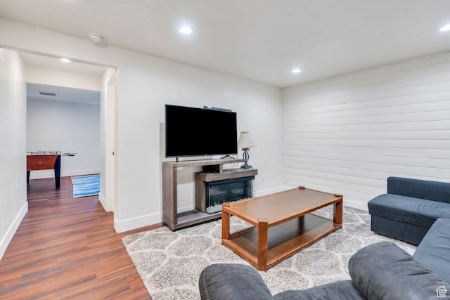 1198 N Reese Dr, Provo, UT 84601 - living room featuring wood finished floors, recessed lighting, and a glass covered fireplace