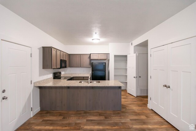 477 S 850 E, American Fork, UT 84003 - kitchen with black appliances, a peninsula, dark wood finished floors, and dark brown cabinetry