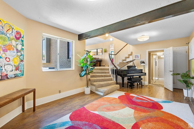 2673 E Toni Cir S, Cottonwood Heights, UT 84121 - entrance foyer with stairway, hardwood / wood-style flooring, beam ceiling, and a textured ceiling