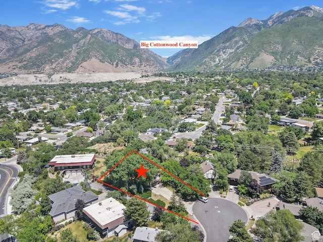 2673 E Toni Cir S, Cottonwood Heights, UT 84121 - aerial perspective of suburban area featuring a mountainous background and property boundaries highlighted