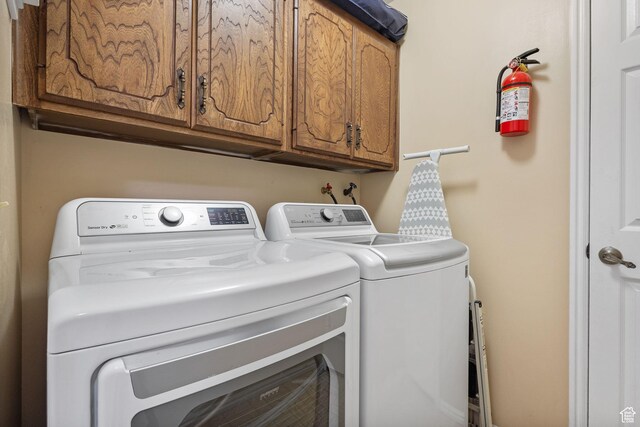 2673 E Toni Cir S, Cottonwood Heights, UT 84121 - laundry room with washer and dryer and cabinet space