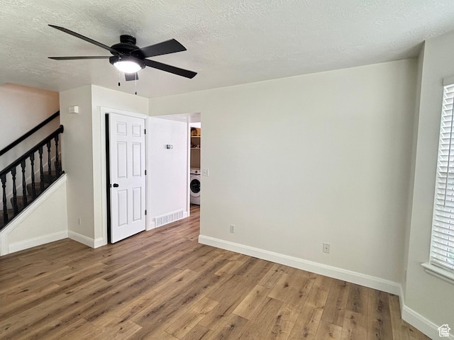 1165 N 2850 W, Provo, UT 84601 - unfurnished room with a ceiling fan, light wood-style floors, washer / dryer, and a textured ceiling