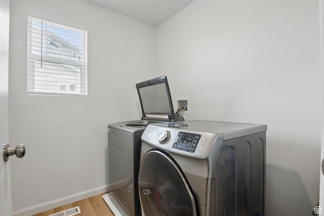 98 E Stroll Ave Unit 809, Saratoga Springs, UT 84045 - laundry room featuring washing machine and clothes dryer and light wood finished floors