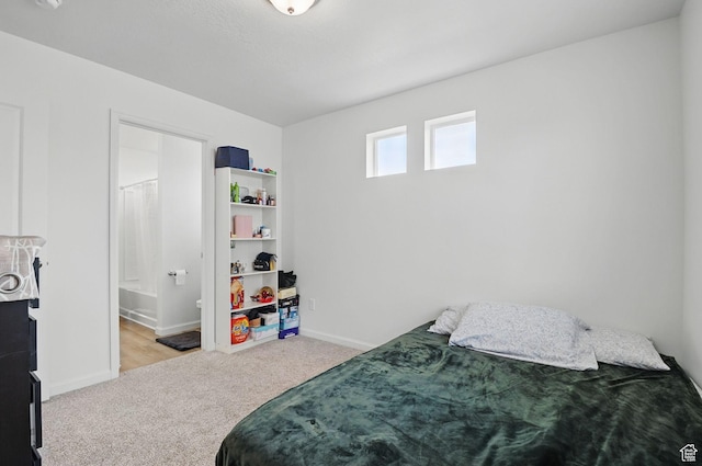 98 E Stroll Ave Unit 809, Saratoga Springs, UT 84045 - carpeted bedroom featuring baseboards and ensuite bathroom