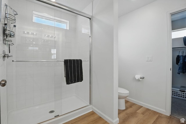 98 E Stroll Ave Unit 809, Saratoga Springs, UT 84045 - bathroom with wood finished floors, a shower stall, and a walk in closet